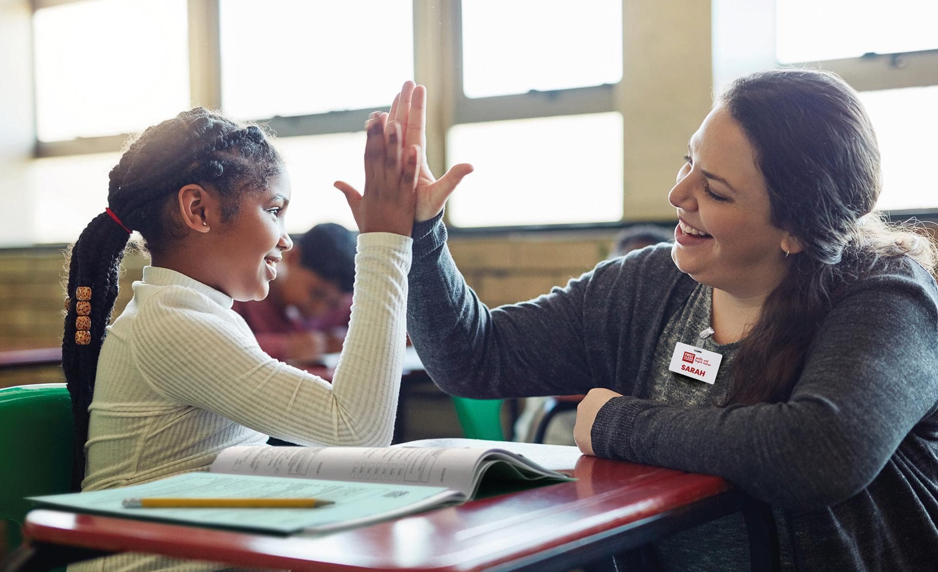 student high five with tuition manager