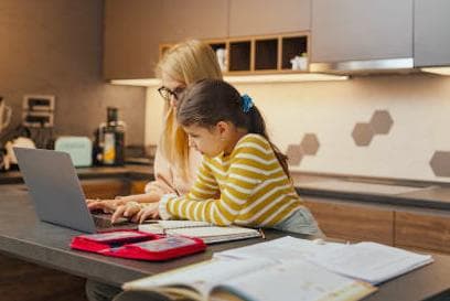 mum and daughter home-schooling