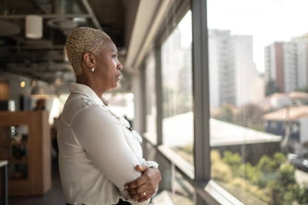 woman looking out of window